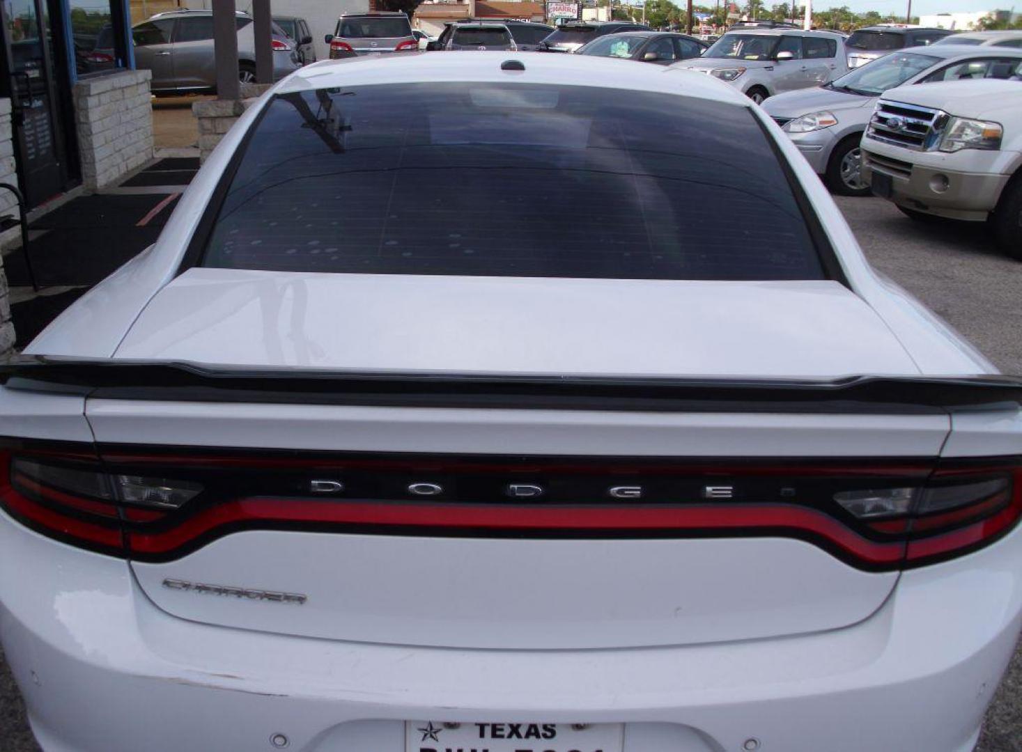 2016 WHITE DODGE CHARGER SE (2C3CDXBG9GH) with an 3.6L engine, Automatic transmission, located at 2215 Harry Wurzbach Rd , San Antonio, TX, 78209, (208) 269-7240, 29.491415, -98.432098 - Photo#7