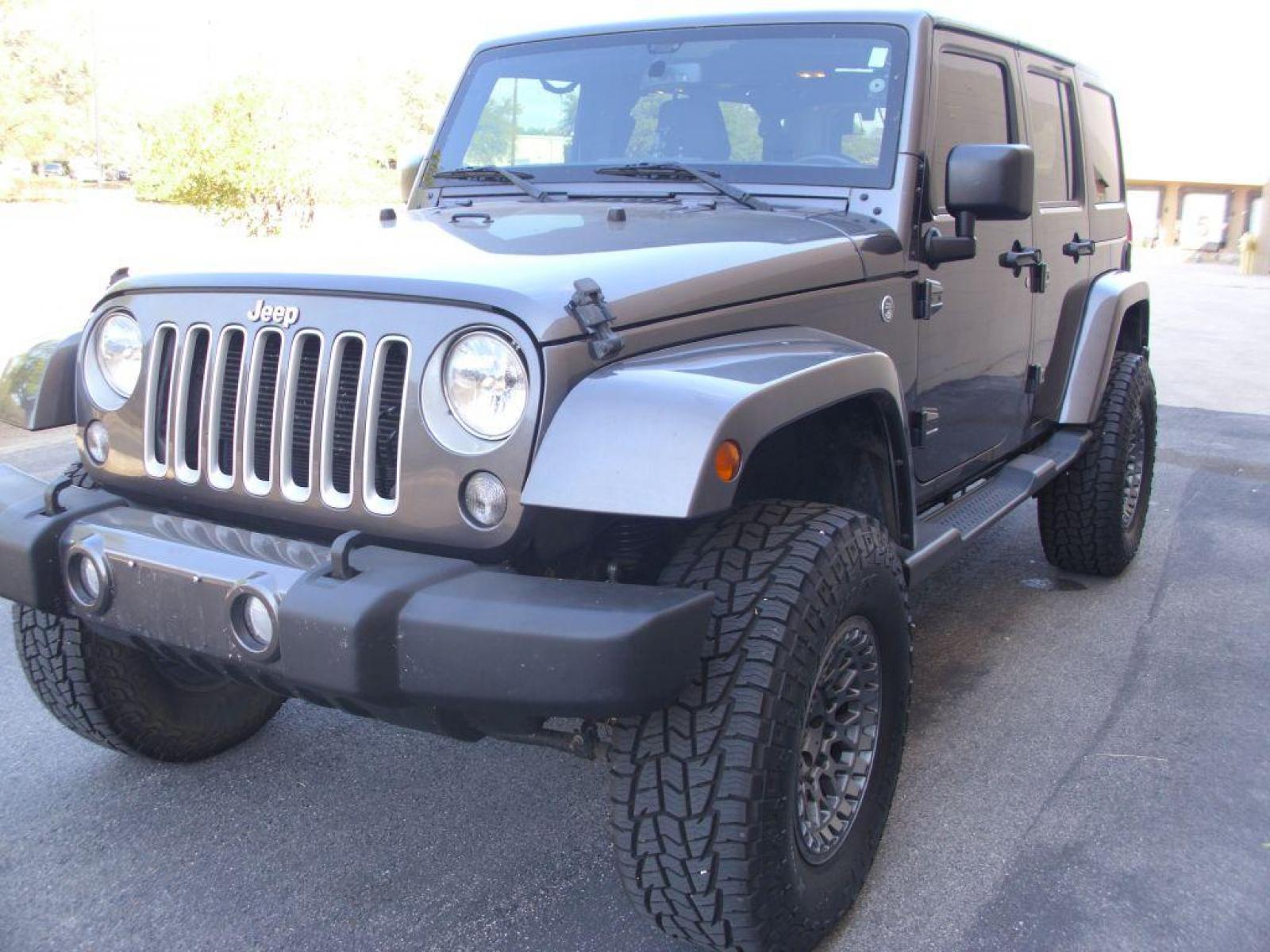 2016 GRAY JEEP WRANGLER UNLIMI SAHARA (1C4BJWEG8GL) with an 3.6L engine, Automatic transmission, located at 12019 San Pedro Avenue, San Antonio, TX, 78216, (210) 494-5895, 29.550915, -98.491142 - AMAZING - LIKE NEW!!! New Lift Metal Cloak; New Wheels; 35 inch Off-Road Hercules; Bluetooth Technology; Cruise Control; Fron Seat Heaters; Hard Top; Leather Seats; Navigation System; Remote Start; Running Boards; Satellite Radio; Tow Hitch; Air Conditioning; Power Windows; Power Locks; Power Steer - Photo #1