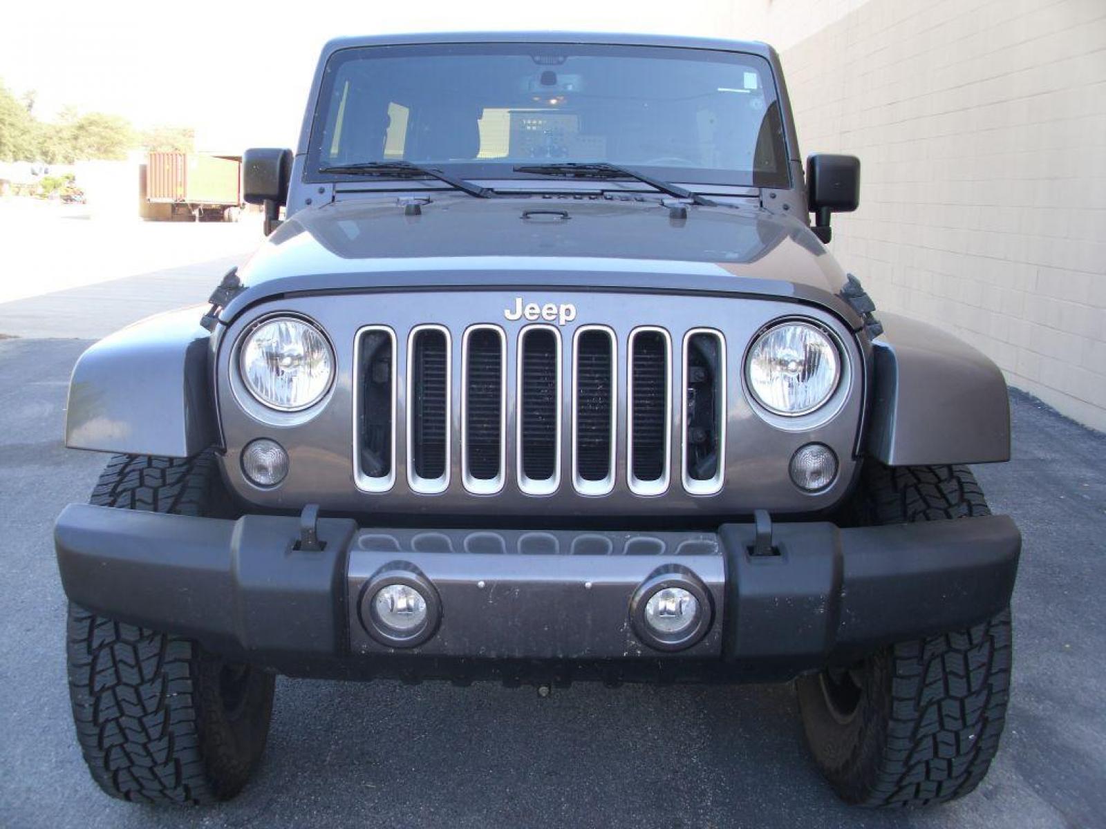 2016 GRAY JEEP WRANGLER UNLIMI SAHARA (1C4BJWEG8GL) with an 3.6L engine, Automatic transmission, located at 12019 San Pedro Avenue, San Antonio, TX, 78216, (210) 494-5895, 29.551861, -98.487602 - New Lift Metal Cloak; New Wheels; 35 inch Off-Road Hercules; Bluetooth Technology; Cruise Control; Fron Seat Heaters; Hard Top; Leather Seats; Navigation System; Remote Start; Running Boards; Satellite Radio; Tow Hitch; Air Conditioning; Power Windows; Power Locks; Power Steering; Tilt Wheel; AM/FM - Photo #2
