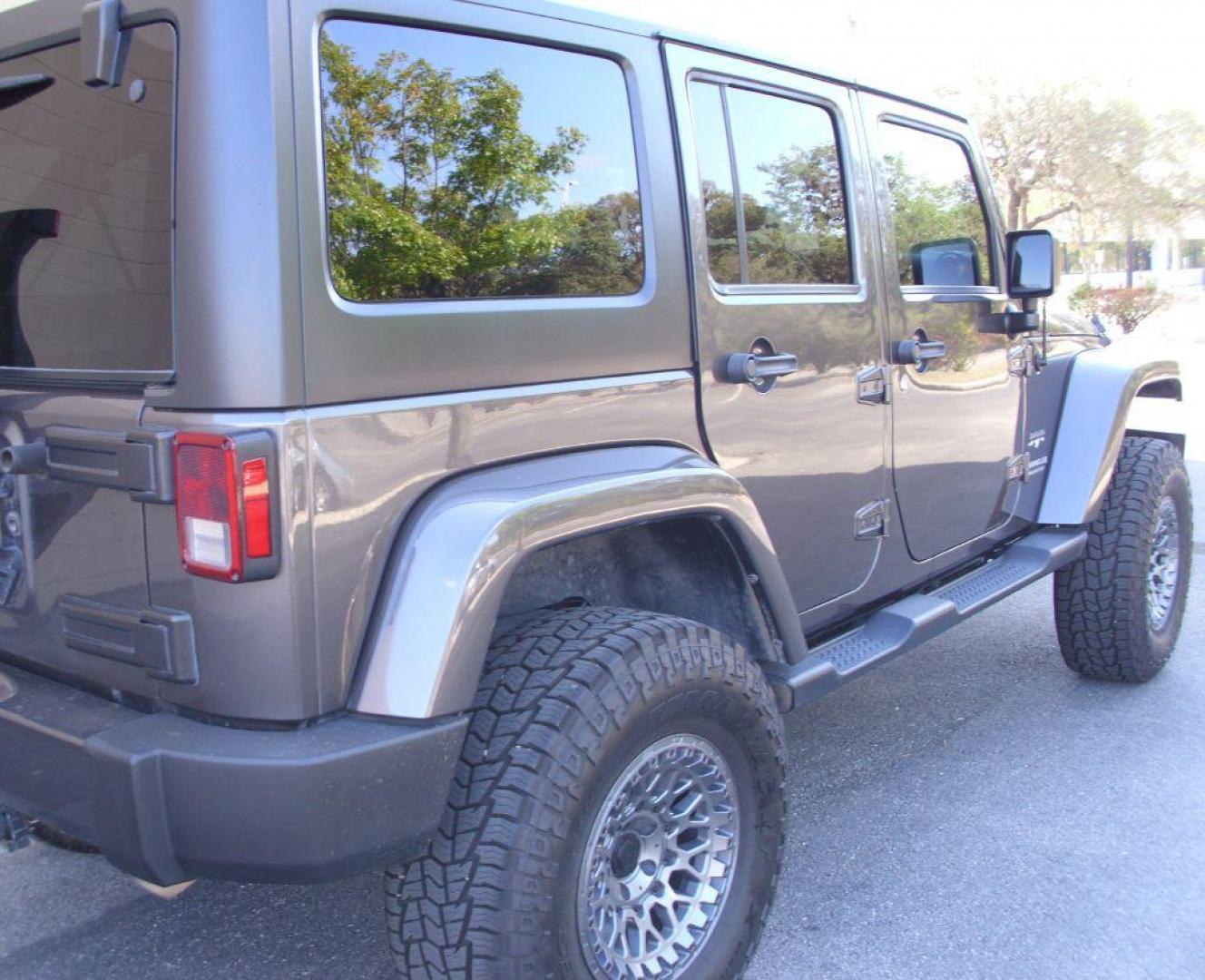 2016 GRAY JEEP WRANGLER UNLIMI SAHARA (1C4BJWEG8GL) with an 3.6L engine, Automatic transmission, located at 12019 San Pedro Avenue, San Antonio, TX, 78216, (210) 494-5895, 29.550915, -98.491142 - We provide financing options through various third-party Credit Unions and Auto Finance Companies, including RBFCU, USAA, SSFCU, Pen Fed, Navy Fed, Credit Human Credit Union of Texas, and most other credit unions. We also work with major banks such as Capital One and Broadway Bank. Payment methods a - Photo#4