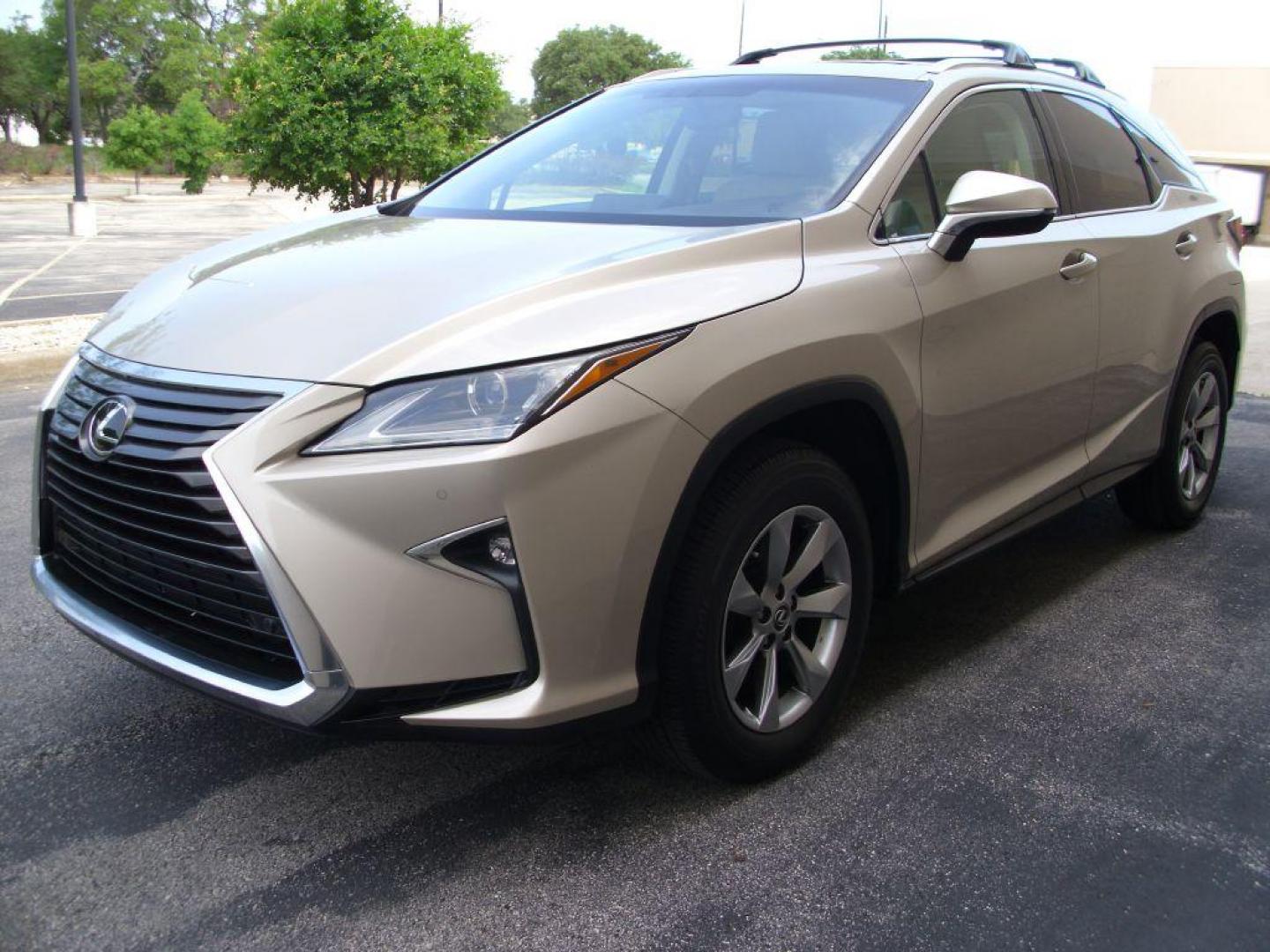 2016 GOLD LEXUS RX 350 (2T2ZZMCA2GC) with an 3.5L engine, Automatic transmission, located at 2215 Harry Wurzbach Rd , San Antonio, TX, 78209, (208) 269-7240, 29.491415, -98.432098 - LEATHER HEATED and COOLED SEATS - SUN ROOF - IMMACULATE!!! Air Conditioning; Power Windows; Power Locks; Power Steering; Tilt Wheel; AM/FM CD/DVD; Satellite; Sentry Key; Keyless Entry; Alarm; Daytime Running Lights; Dual Front Airbags; Side Airbags; Head Airbags; Rear Head Airbags; Active Seatbel - Photo#2