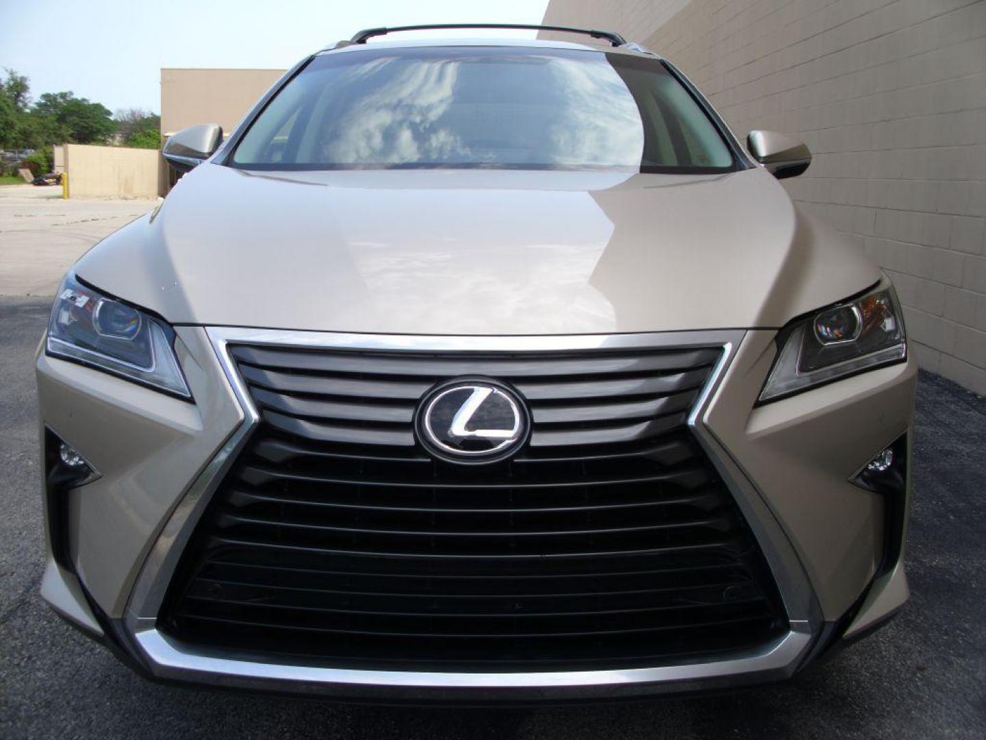 2016 GOLD LEXUS RX 350 (2T2ZZMCA2GC) with an 3.5L engine, Automatic transmission, located at 2215 Harry Wurzbach Rd , San Antonio, TX, 78209, (208) 269-7240, 29.491415, -98.432098 - LEATHER HEATED and COOLED SEATS - SUN ROOF - IMMACULATE!!! Air Conditioning; Power Windows; Power Locks; Power Steering; Tilt Wheel; AM/FM CD/DVD; Satellite; Sentry Key; Keyless Entry; Alarm; Daytime Running Lights; Dual Front Airbags; Side Airbags; Head Airbags; Rear Head Airbags; Active Seatbel - Photo#3