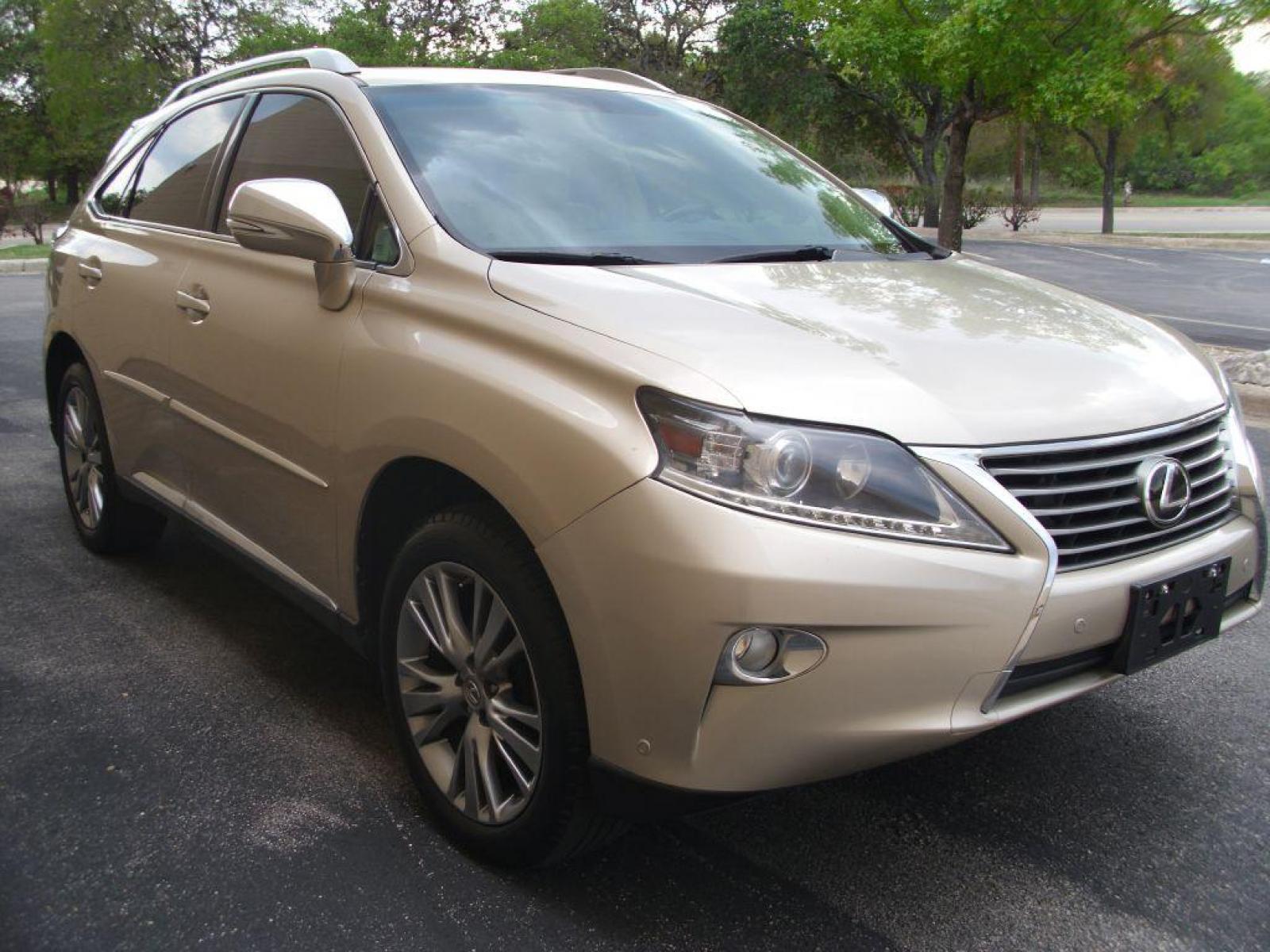 2013 GOLD LEXUS RX 350 (2T2ZK1BA5DC) with an 3.5L engine, Automatic transmission, located at 12019 San Pedro Avenue, San Antonio, TX, 78216, (210) 494-5895, 29.551861, -98.487602 - Blind-Spot Monitor; Backup Camera; Bluetooth Wireless; Leather Seats; Heated Seats; Navigation System; Parking Sensors; Power Liftgate; Smart Key; Tow Hitch; Roof Rack; Air Conditioning; Power Windows; Power Locks; Power Steering; Tilt Wheel; AM/FM CD/DVD; Satellite; Sentry Key; Keyless Entry; Alarm - Photo #2