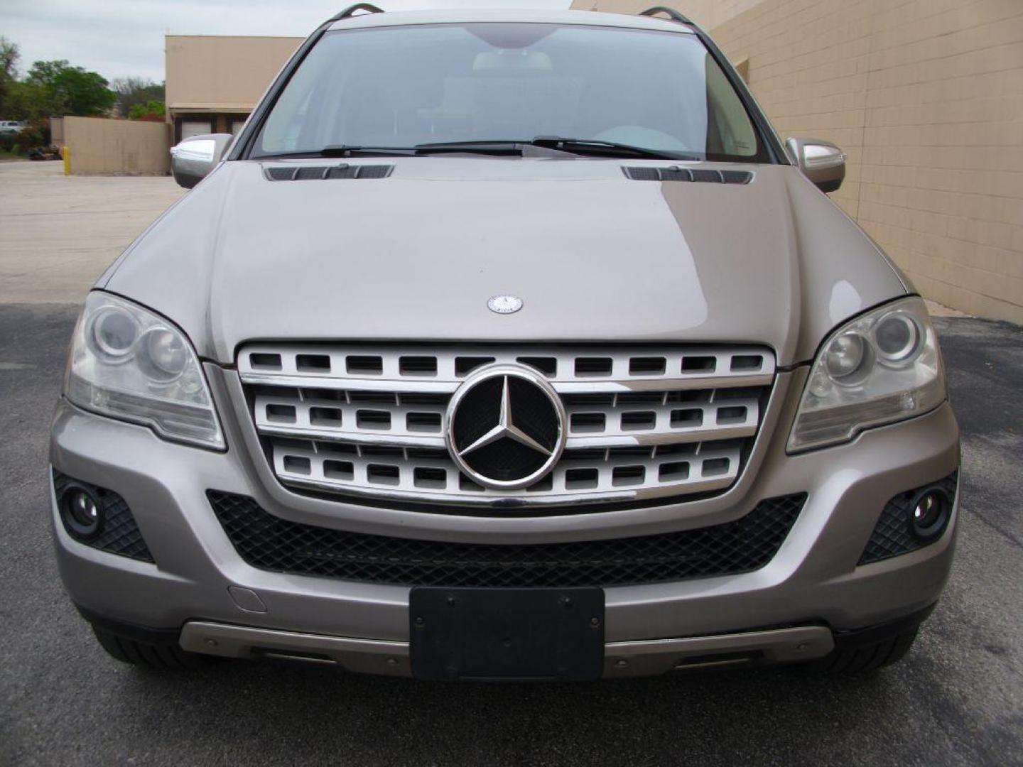 2009 TAN MERCEDES-BENZ ML350 350 (4JGBB86E89A) with an 3.5L engine, Automatic transmission, located at 12019 San Pedro Avenue, San Antonio, TX, 78216, (210) 494-5895, 29.550915, -98.491142 - LOW MILES - EXTRA CLEAN - PICTURE PERFECT - 4WD/AWD; ABS Brakes; AM/FM Stereo; Air Conditioning; Alloy Wheels; Automatic Transmission; Auxiliary Audio Input; Bluetooth Technology; CD Audio; Cruise Control; Harman Kardon Sound; Leatherette Seats; Navigation System; Overhead Airbags; Power Hatch/Deck - Photo#1