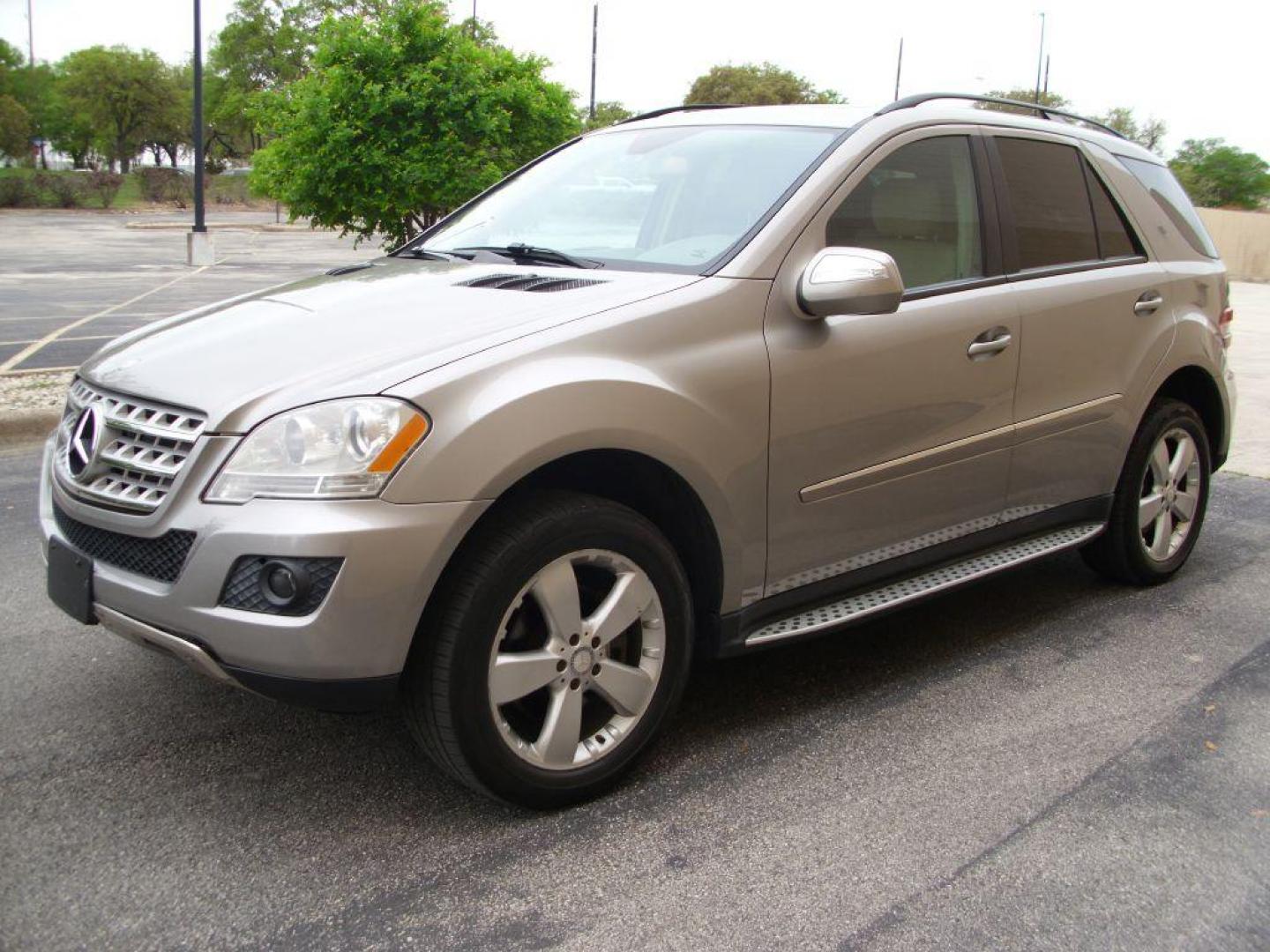 2009 TAN MERCEDES-BENZ ML350 350 (4JGBB86E89A) with an 3.5L engine, Automatic transmission, located at 12019 San Pedro Avenue, San Antonio, TX, 78216, (210) 494-5895, 29.550915, -98.491142 - LOW MILES - EXTRA CLEAN - PICTURE PERFECT - 4WD/AWD; ABS Brakes; AM/FM Stereo; Air Conditioning; Alloy Wheels; Automatic Transmission; Auxiliary Audio Input; Bluetooth Technology; CD Audio; Cruise Control; Harman Kardon Sound; Leatherette Seats; Navigation System; Overhead Airbags; Power Hatch/Deck - Photo#2