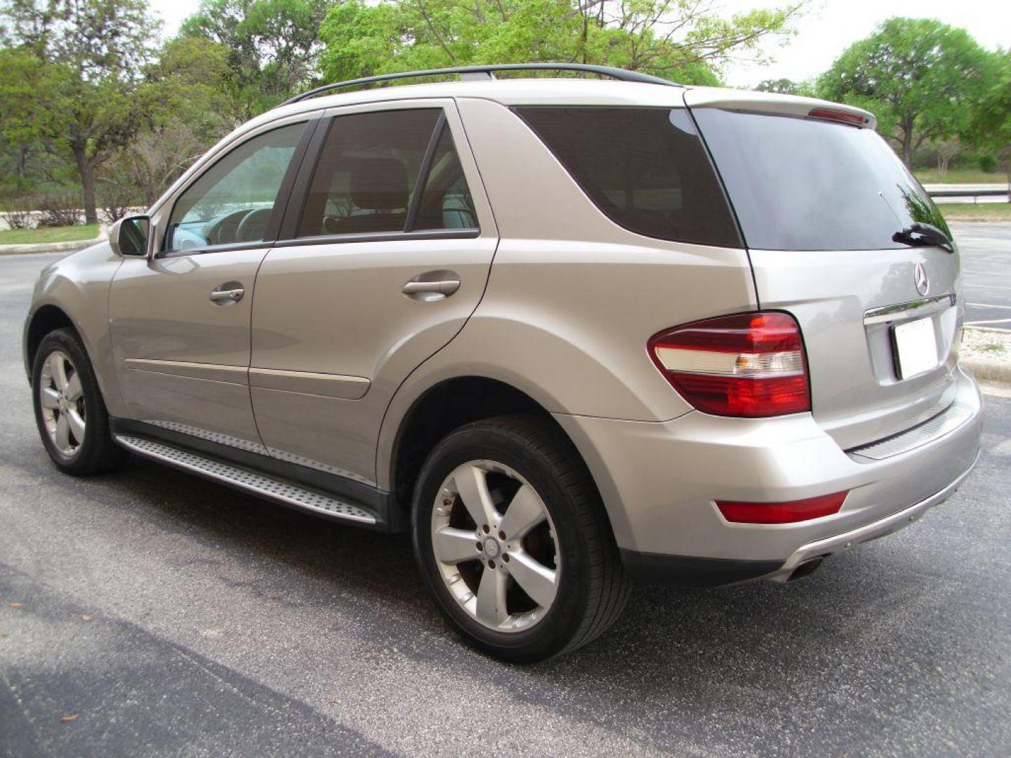 2009 TAN MERCEDES-BENZ ML350 350 (4JGBB86E89A) with an 3.5L engine, Automatic transmission, located at 12019 San Pedro Avenue, San Antonio, TX, 78216, (210) 494-5895, 29.550915, -98.491142 - LOW MILES - EXTRA CLEAN - PICTURE PERFECT - 4WD/AWD; ABS Brakes; AM/FM Stereo; Air Conditioning; Alloy Wheels; Automatic Transmission; Auxiliary Audio Input; Bluetooth Technology; CD Audio; Cruise Control; Harman Kardon Sound; Leatherette Seats; Navigation System; Overhead Airbags; Power Hatch/Deck - Photo#5