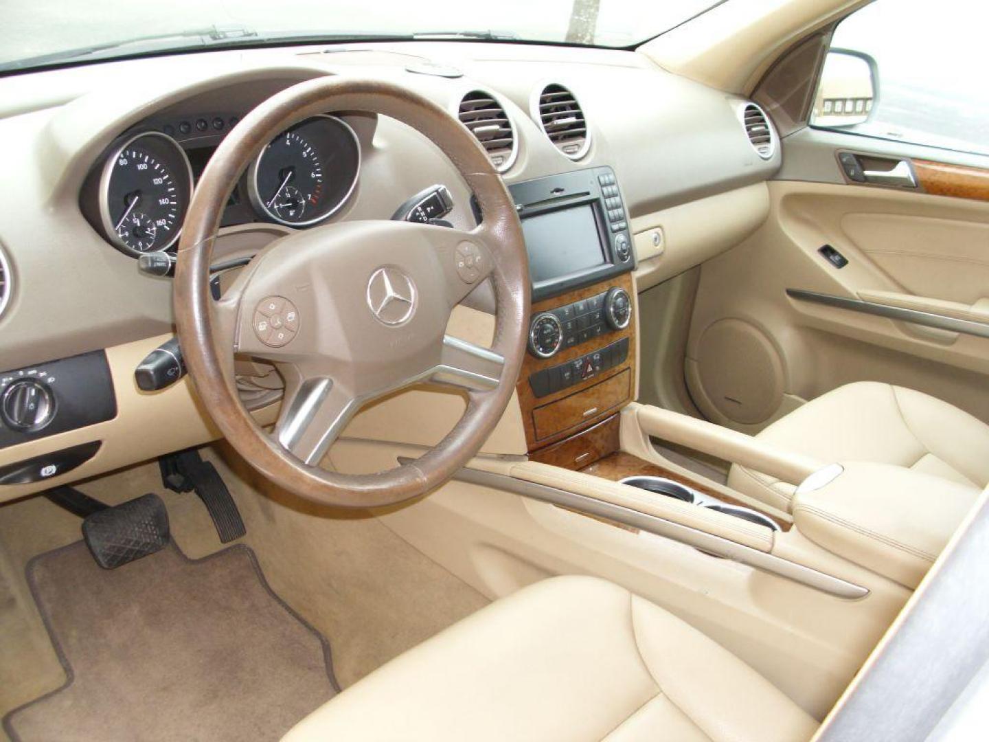 2009 TAN MERCEDES-BENZ ML350 350 (4JGBB86E89A) with an 3.5L engine, Automatic transmission, located at 12019 San Pedro Avenue, San Antonio, TX, 78216, (210) 494-5895, 29.550915, -98.491142 - LOW MILES - EXTRA CLEAN - PICTURE PERFECT - 4WD/AWD; ABS Brakes; AM/FM Stereo; Air Conditioning; Alloy Wheels; Automatic Transmission; Auxiliary Audio Input; Bluetooth Technology; CD Audio; Cruise Control; Harman Kardon Sound; Leatherette Seats; Navigation System; Overhead Airbags; Power Hatch/Deck - Photo#6