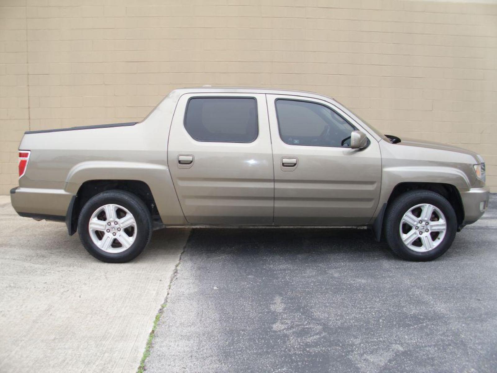 2009 BROWN HONDA RIDGELINE RTL (2HJYK16599H) with an 3.5L engine, Automatic transmission, located at 12019 San Pedro Avenue, San Antonio, TX, 78216, (210) 494-5895, 29.550915, -98.491142 - LOW, LOW MILES - LEATHER - NEW TIRES - RARE FIND!!! Air Conditioning; Power Windows; Power Locks; Power Steering; Tilt Wheel; AM/FM CD/MP3; Satellite; Immobilizer; Keyless Entry; Alarm; Daytime Running Lights; Dual Front Airbags; Side Airbags; Head Airbags; Rear Head Airbags; Active Seatbelts; Crew - Photo #0