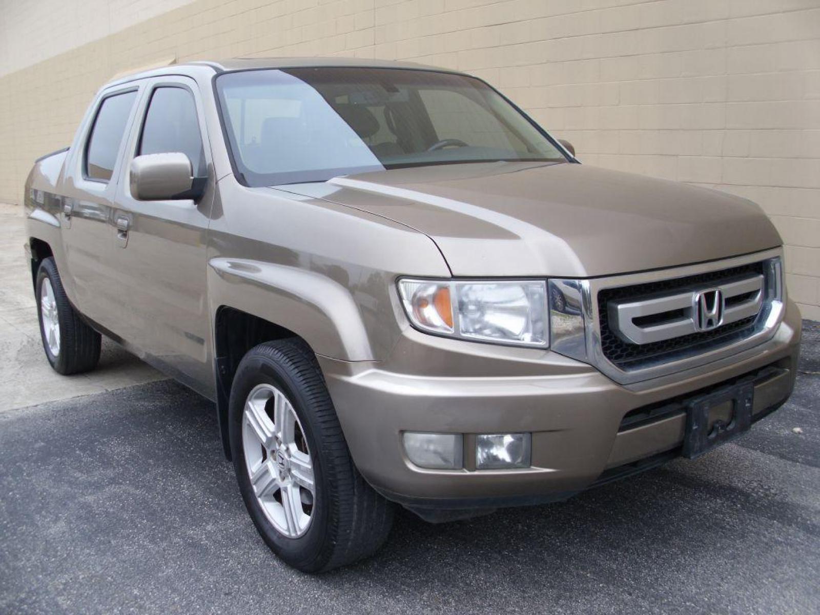 2009 BROWN HONDA RIDGELINE RTL (2HJYK16599H) with an 3.5L engine, Automatic transmission, located at 12019 San Pedro Avenue, San Antonio, TX, 78216, (210) 494-5895, 29.550915, -98.491142 - LOW, LOW MILES - LEATHER - NEW TIRES - RARE FIND!!! Air Conditioning; Power Windows; Power Locks; Power Steering; Tilt Wheel; AM/FM CD/MP3; Satellite; Immobilizer; Keyless Entry; Alarm; Daytime Running Lights; Dual Front Airbags; Side Airbags; Head Airbags; Rear Head Airbags; Active Seatbelts; Crew - Photo #1