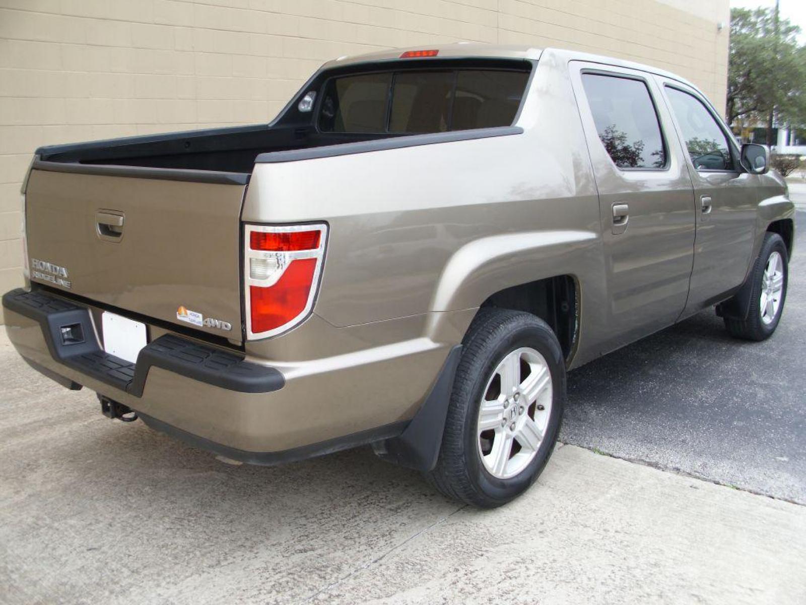 2009 BROWN HONDA RIDGELINE RTL (2HJYK16599H) with an 3.5L engine, Automatic transmission, located at 12019 San Pedro Avenue, San Antonio, TX, 78216, (210) 494-5895, 29.550915, -98.491142 - LOW, LOW MILES - LEATHER - NEW TIRES - RARE FIND!!! Air Conditioning; Power Windows; Power Locks; Power Steering; Tilt Wheel; AM/FM CD/MP3; Satellite; Immobilizer; Keyless Entry; Alarm; Daytime Running Lights; Dual Front Airbags; Side Airbags; Head Airbags; Rear Head Airbags; Active Seatbelts; Crew - Photo #3