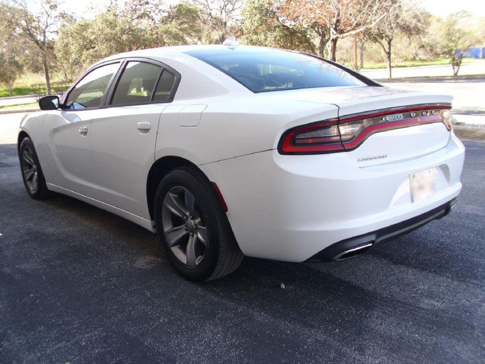 2016 WHITE DODGE CHARGER SXT (2C3CDXHGXGH) with an 3.6L engine, Automatic transmission, located at 12019 San Pedro Avenue, San Antonio, TX, 78216, (210) 494-5895, 29.550915, -98.491142 - LOW MILES - VERY CLEAN - RUNS GREAT!!! Air Conditioning; Power Windows; Power Locks; Power Steering; Tilt Wheel; AM/FM CD ; Sentry Key; Keyless Entry; Alarm; Daytime Running Lights; Dual Front Airbags; Side Airbags; Head Airbags; Rear Head Airbags; Active Seatbelts; All Wheel ABS; Alloy Wheels; Alp - Photo #1