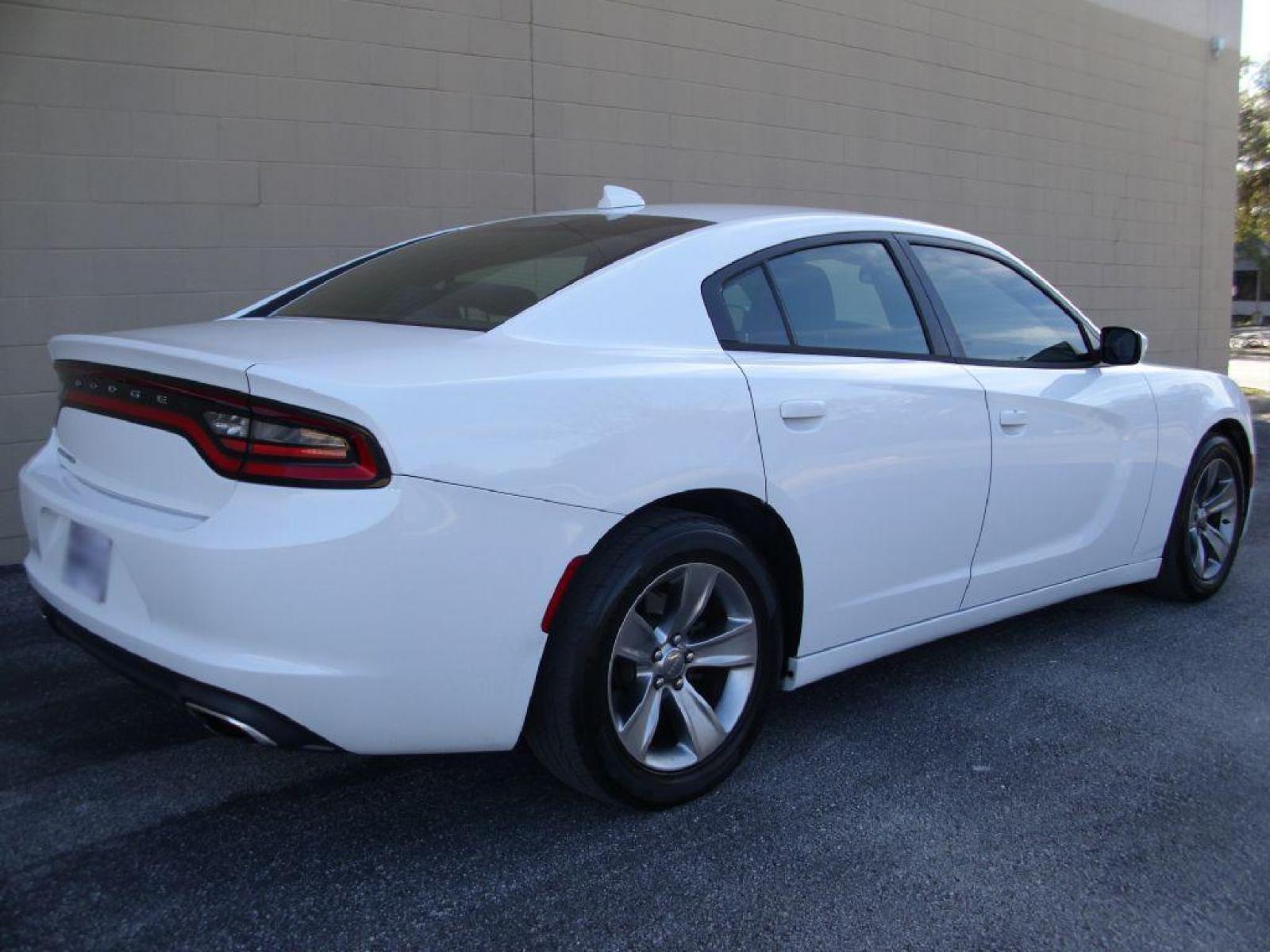 2016 WHITE DODGE CHARGER SXT (2C3CDXHGXGH) with an 3.6L engine, Automatic transmission, located at 12019 San Pedro Avenue, San Antonio, TX, 78216, (210) 494-5895, 29.550915, -98.491142 - LOW MILES - VERY CLEAN - RUNS GREAT!!! Air Conditioning; Power Windows; Power Locks; Power Steering; Tilt Wheel; AM/FM CD ; Sentry Key; Keyless Entry; Alarm; Daytime Running Lights; Dual Front Airbags; Side Airbags; Head Airbags; Rear Head Airbags; Active Seatbelts; All Wheel ABS; Alloy Wheels; Alp - Photo #4
