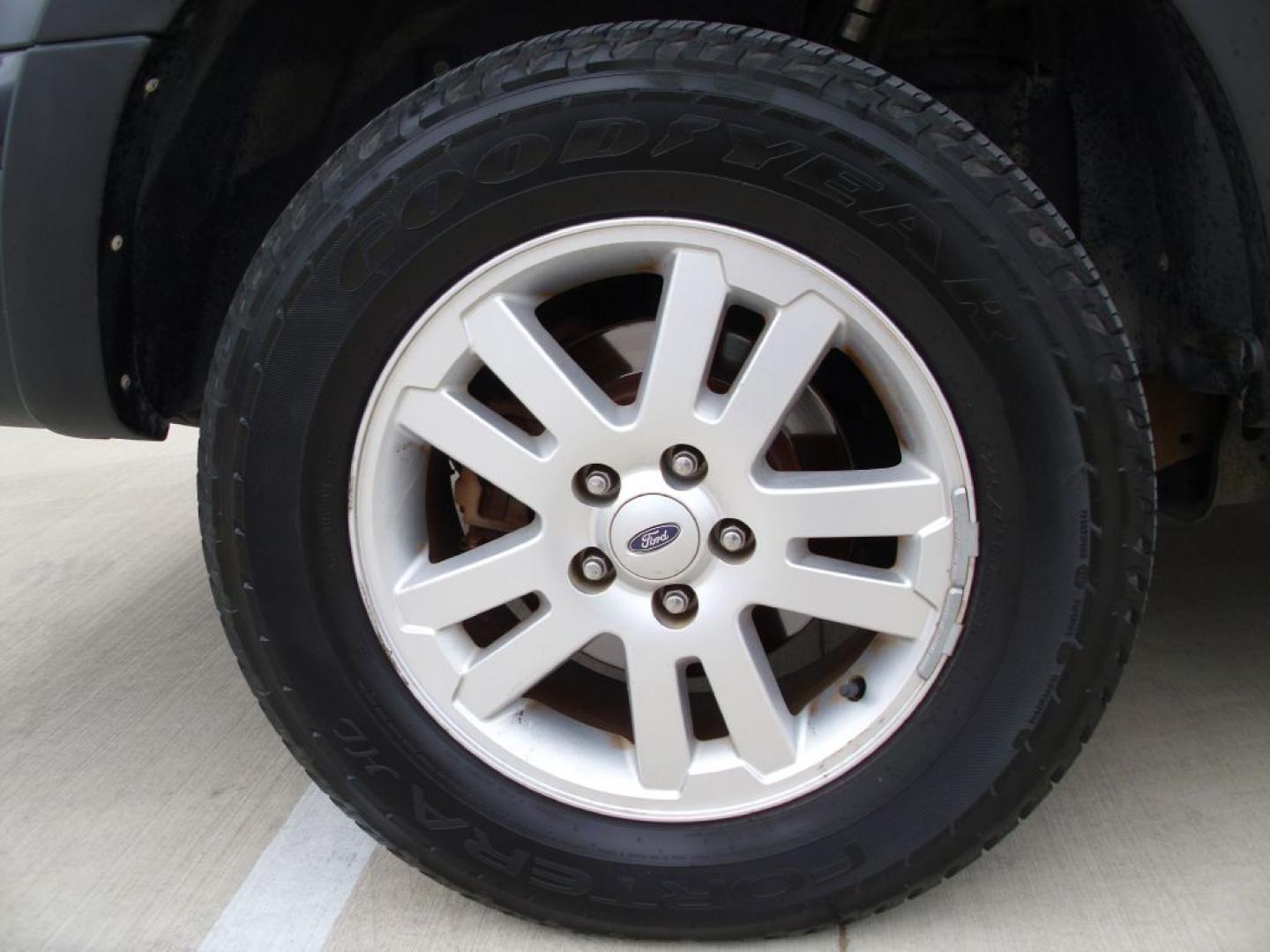 2009 BLACK FORD EXPLORER SPORT XLT (1FMEU31E49U) with an 4.0L engine, Automatic transmission, located at 2215 Harry Wurzbach Rd , San Antonio, TX, 78209, (208) 269-7240, 29.491415, -98.432098- Photo#12
