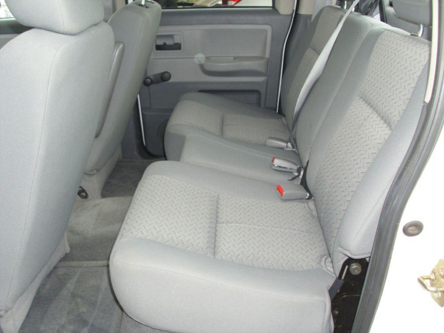 2007 WHITE DODGE DAKOTA QUAD (1D7HE28K47S) with an 3.7L engine, Automatic transmission, located at 2215 Harry Wurzbach Rd , San Antonio, TX, 78209, (208) 269-7240, 29.491415, -98.432098 - RELIABLE TRUCK - NO ACCIDENTS OR DAMAGES! SPORT PACKAGE! 2WD; Cloth Seats; Tow Hitch; Air Conditioning; ABS Brakes; Automatic Transmission; Cruise Control; Power Steering; Tilt Wheel; AM/FM CD; Satellite; Dual Front Air Bag; Active Belts; Crew Cab; Short Bed; All Wheel ABS; 1/2 Ton We provide fi - Photo#13