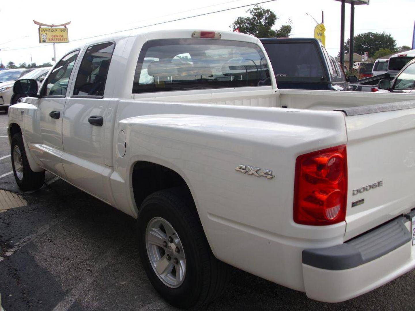 2009 WHITE DODGE DAKOTA SXT (1D3HW38P39S) with an 4.7L engine, Automatic transmission, located at 2215 Harry Wurzbach Rd , San Antonio, TX, 78209, (208) 269-7240, 29.491415, -98.432098 - 4X4- LOW MILEAGE WITH ALLOY WHEELS! Cloth Seats, Tow Hitch, Air Conditioning; Power Windows; Power Locks; Power Steering; Tilt Wheel; AM/FM CD/MP3; Satellite; Active keyless entry; Available; Dual Air Bags Front and Sides; Active Belts; Crew Cab; Regular Bed; All Wheel ABS; 1/2 Ton. We provide - Photo#8