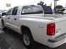 2009 WHITE DODGE DAKOTA SXT (1D3HW38P39S) with an 4.7L engine, Automatic transmission, located at 2215 Harry Wurzbach Rd , San Antonio, TX, 78209, (208) 269-7240, 29.491415, -98.432098 - 4X4- LOW MILEAGE WITH ALLOY WHEELS! Cloth Seats, Tow Hitch, Air Conditioning; Power Windows; Power Locks; Power Steering; Tilt Wheel; AM/FM CD/MP3; Satellite; Active keyless entry; Available; Dual Air Bags Front and Sides; Active Belts; Crew Cab; Regular Bed; All Wheel ABS; 1/2 Ton. We provide - Photo#8