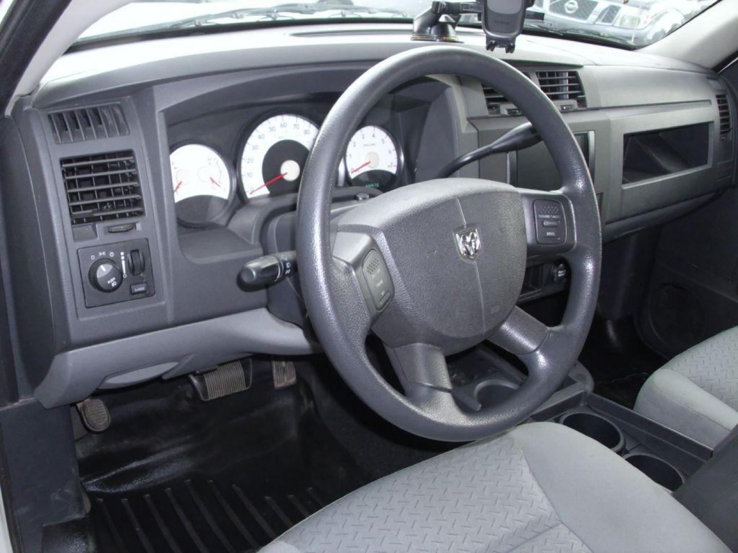 2009 WHITE DODGE DAKOTA SXT (1D3HW38P39S) with an 4.7L engine, Automatic transmission, located at 2215 Harry Wurzbach Rd , San Antonio, TX, 78209, (208) 269-7240, 29.491415, -98.432098 - 4X4- LOW MILEAGE WITH ALLOY WHEELS! Cloth Seats, Tow Hitch, Air Conditioning; Power Windows; Power Locks; Power Steering; Tilt Wheel; AM/FM CD/MP3; Satellite; Active keyless entry; Available; Dual Air Bags Front and Sides; Active Belts; Crew Cab; Regular Bed; All Wheel ABS; 1/2 Ton. We provide - Photo#11
