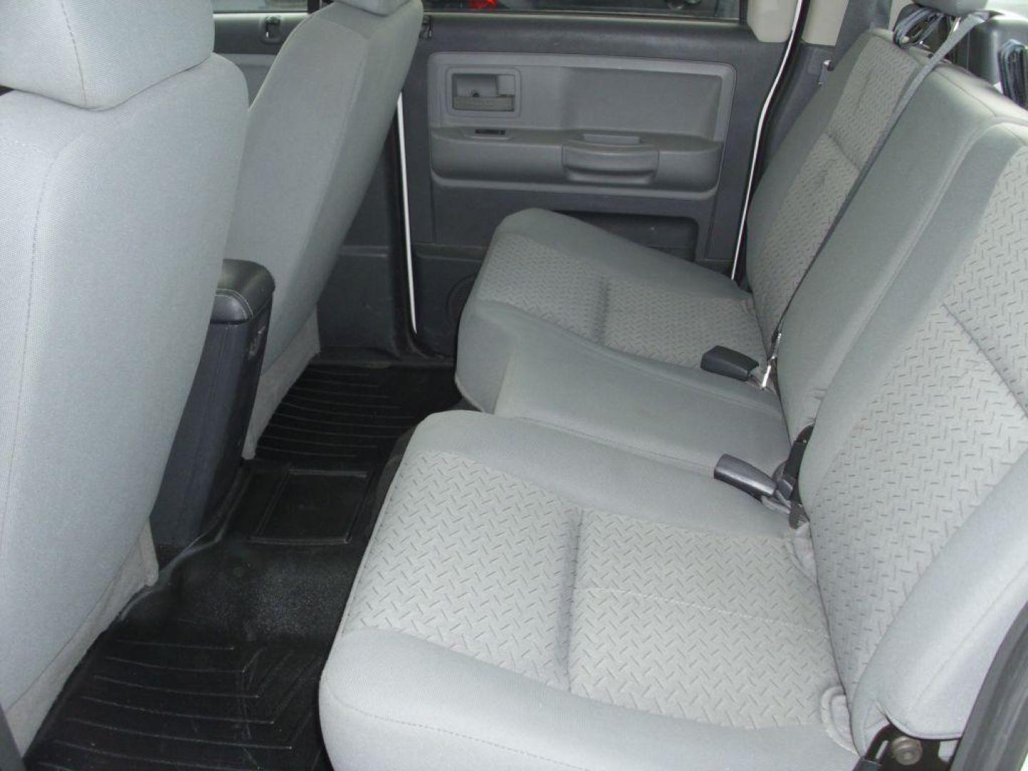 2009 WHITE DODGE DAKOTA SXT (1D3HW38P39S) with an 4.7L engine, Automatic transmission, located at 2215 Harry Wurzbach Rd , San Antonio, TX, 78209, (208) 269-7240, 29.491415, -98.432098 - 4X4- LOW MILEAGE WITH ALLOY WHEELS! Cloth Seats, Tow Hitch, Air Conditioning; Power Windows; Power Locks; Power Steering; Tilt Wheel; AM/FM CD/MP3; Satellite; Active keyless entry; Available; Dual Air Bags Front and Sides; Active Belts; Crew Cab; Regular Bed; All Wheel ABS; 1/2 Ton. We provide - Photo#15