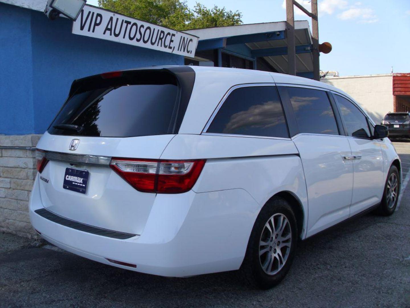 2012 WHITE HONDA ODYSSEY EXL (5FNRL5H69CB) with an 3.5L engine, Automatic transmission, located at 2215 Harry Wurzbach Rd , San Antonio, TX, 78209, (208) 269-7240, 29.491415, -98.432098 - PERFECT VAN FOR ROADTRIPS- ONE OWNER - FOLD AWAY THIRD ROW- FRONT SEAT HEATERS; Leather Seats; Rear Air Conditioning; Rear View Camera; Sunroof(s); Rear Sunshade; Power Hatch/Deck Lid; Air Conditioning; Power Windows; Power Locks; Power Steering; Tilt Wheel; AM/FM CD/MP3; Satellite; AM/FM CD/DVD; Im - Photo#2