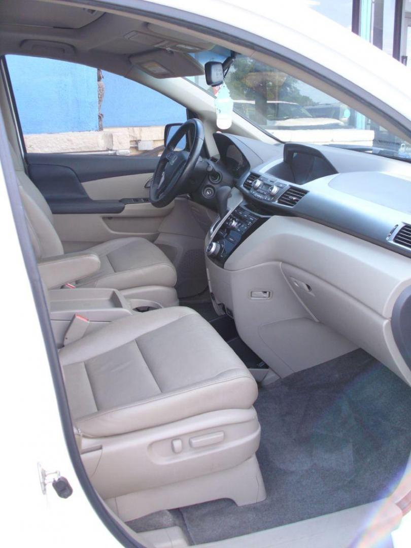 2012 WHITE HONDA ODYSSEY EXL (5FNRL5H69CB) with an 3.5L engine, Automatic transmission, located at 2215 Harry Wurzbach Rd , San Antonio, TX, 78209, (208) 269-7240, 29.491415, -98.432098 - PERFECT VAN FOR ROADTRIPS- ONE OWNER - FOLD AWAY THIRD ROW- FRONT SEAT HEATERS; Leather Seats; Rear Air Conditioning; Rear View Camera; Sunroof(s); Rear Sunshade; Power Hatch/Deck Lid; Air Conditioning; Power Windows; Power Locks; Power Steering; Tilt Wheel; AM/FM CD/MP3; Satellite; AM/FM CD/DVD; Im - Photo#8