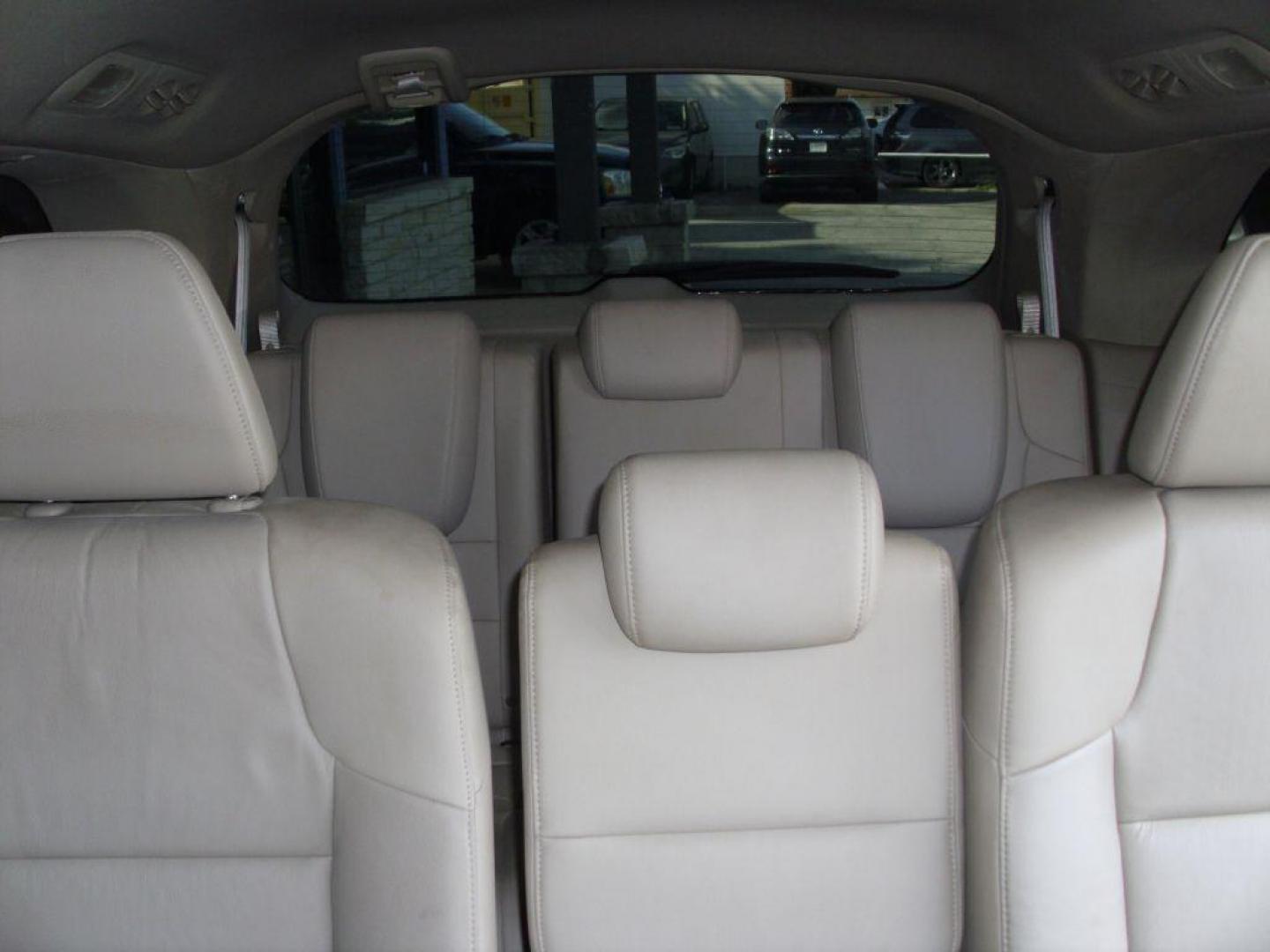 2012 WHITE HONDA ODYSSEY EXL (5FNRL5H69CB) with an 3.5L engine, Automatic transmission, located at 2215 Harry Wurzbach Rd , San Antonio, TX, 78209, (208) 269-7240, 29.491415, -98.432098 - PERFECT VAN FOR ROADTRIPS- ONE OWNER - FOLD AWAY THIRD ROW- FRONT SEAT HEATERS; Leather Seats; Rear Air Conditioning; Rear View Camera; Sunroof(s); Rear Sunshade; Power Hatch/Deck Lid; Air Conditioning; Power Windows; Power Locks; Power Steering; Tilt Wheel; AM/FM CD/MP3; Satellite; AM/FM CD/DVD; Im - Photo#11