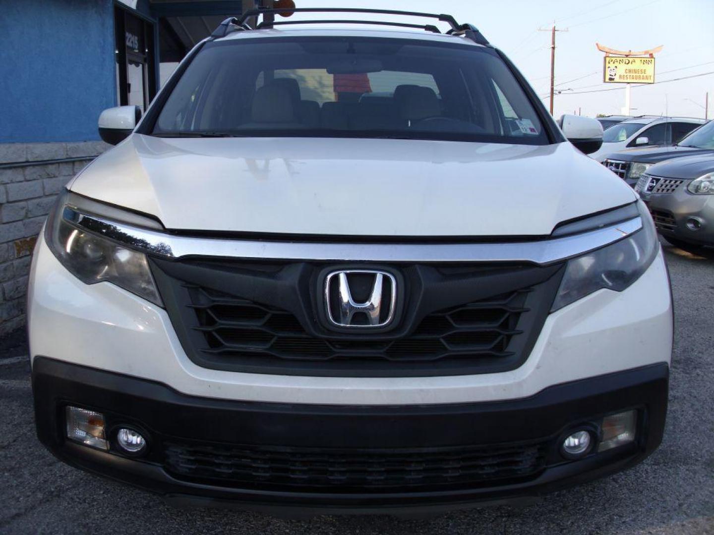 2017 WHITE HONDA RIDGELINE RTL (5FPYK2F59HB) with an 3.5L engine, Automatic transmission, located at 2215 Harry Wurzbach Rd , San Antonio, TX, 78209, (208) 269-7240, 29.491415, -98.432098 - ABS Brakes; Air Conditioning; Alloy Wheels; AM/FM Stereo; Automatic Transmission; Auxiliary Audio Input; Bed Liner; Bluetooth Technology; Cruise Control; Front Seat Heaters; Full Roof Rack; Leather Seats; Overhead Airbags; Parking Sensors; Power Locks; Power Mirrors; Power Seat(s); Power Windows; Re - Photo#2