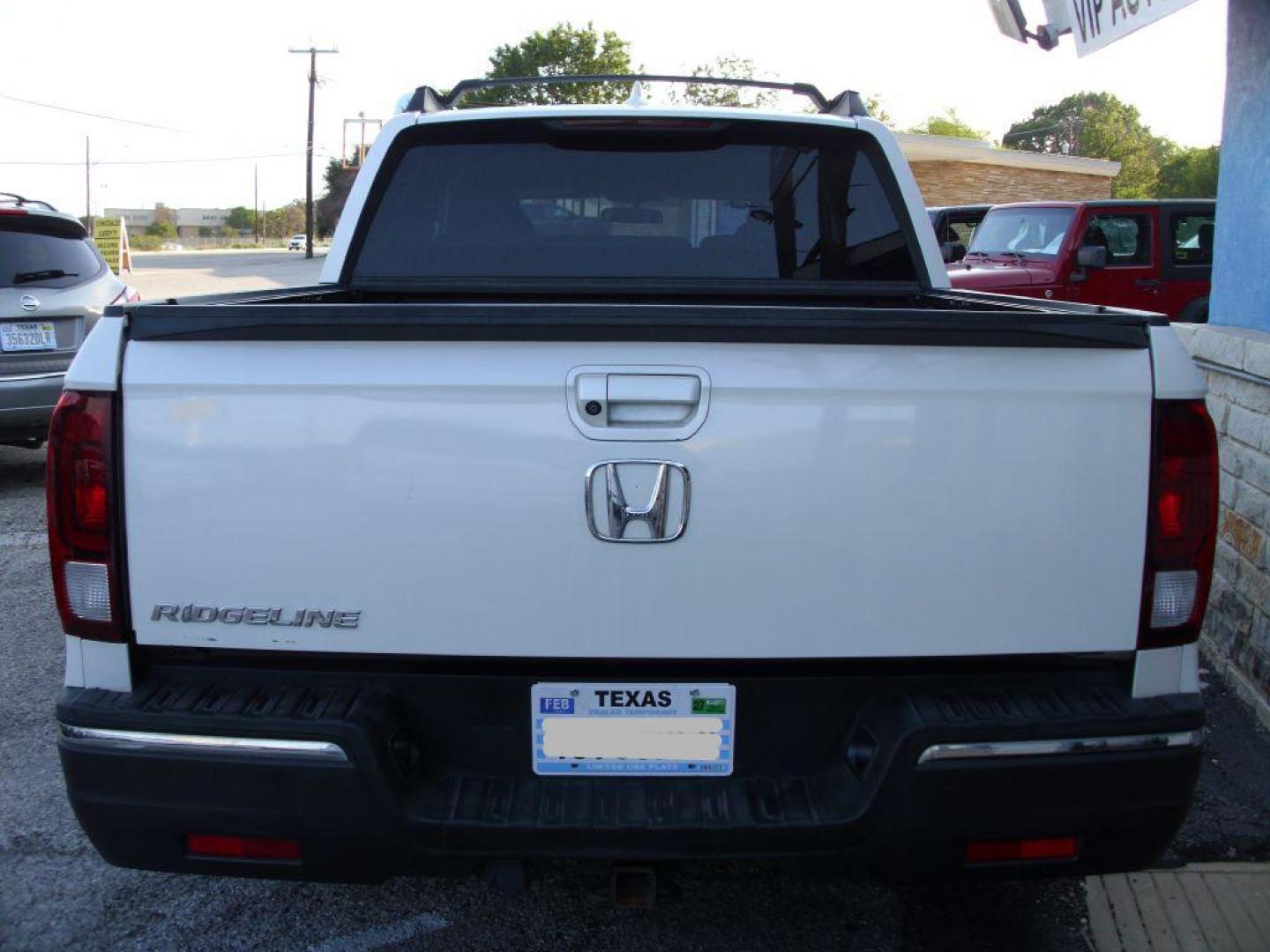 2017 WHITE HONDA RIDGELINE RTL (5FPYK2F59HB) with an 3.5L engine, Automatic transmission, located at 2215 Harry Wurzbach Rd , San Antonio, TX, 78209, (208) 269-7240, 29.491415, -98.432098 - ABS Brakes; Air Conditioning; Alloy Wheels; AM/FM Stereo; Automatic Transmission; Auxiliary Audio Input; Bed Liner; Bluetooth Technology; Cruise Control; Front Seat Heaters; Full Roof Rack; Leather Seats; Overhead Airbags; Parking Sensors; Power Locks; Power Mirrors; Power Seat(s); Power Windows; Re - Photo#3