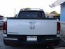 2017 WHITE HONDA RIDGELINE RTL (5FPYK2F59HB) with an 3.5L engine, Automatic transmission, located at 2215 Harry Wurzbach Rd , San Antonio, TX, 78209, (208) 269-7240, 29.491415, -98.432098 - ABS Brakes; Air Conditioning; Alloy Wheels; AM/FM Stereo; Automatic Transmission; Auxiliary Audio Input; Bed Liner; Bluetooth Technology; Cruise Control; Front Seat Heaters; Full Roof Rack; Leather Seats; Overhead Airbags; Parking Sensors; Power Locks; Power Mirrors; Power Seat(s); Power Windows; Re - Photo#4