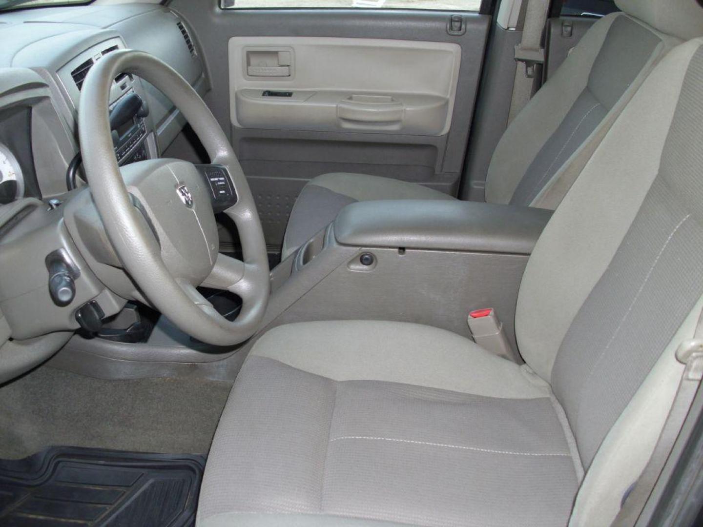 2006 BLACK DODGE DAKOTA QUAD SLT (1D7HW48N36S) with an 4.7L engine, Automatic transmission, located at 2215 Harry Wurzbach Rd , San Antonio, TX, 78209, (208) 269-7240, 29.491415, -98.432098 - GREAT TRUCK- 4X4 WITH AUTOMATIC TRANSMISSION; ABS Brakes; Alloy Wheels; Bed Liner; Cloth Seats; Cruise Control; Power Locks; CD; Passive sentry key; Available; Dual Front Air Bag; Active Belts; Tow Hitch; Crew Cab; Short Bed; All Wheel ABS; 1/2 Ton. ** WE DO NOT OFFER BUY HERE PAY HERE FINAN - Photo#7