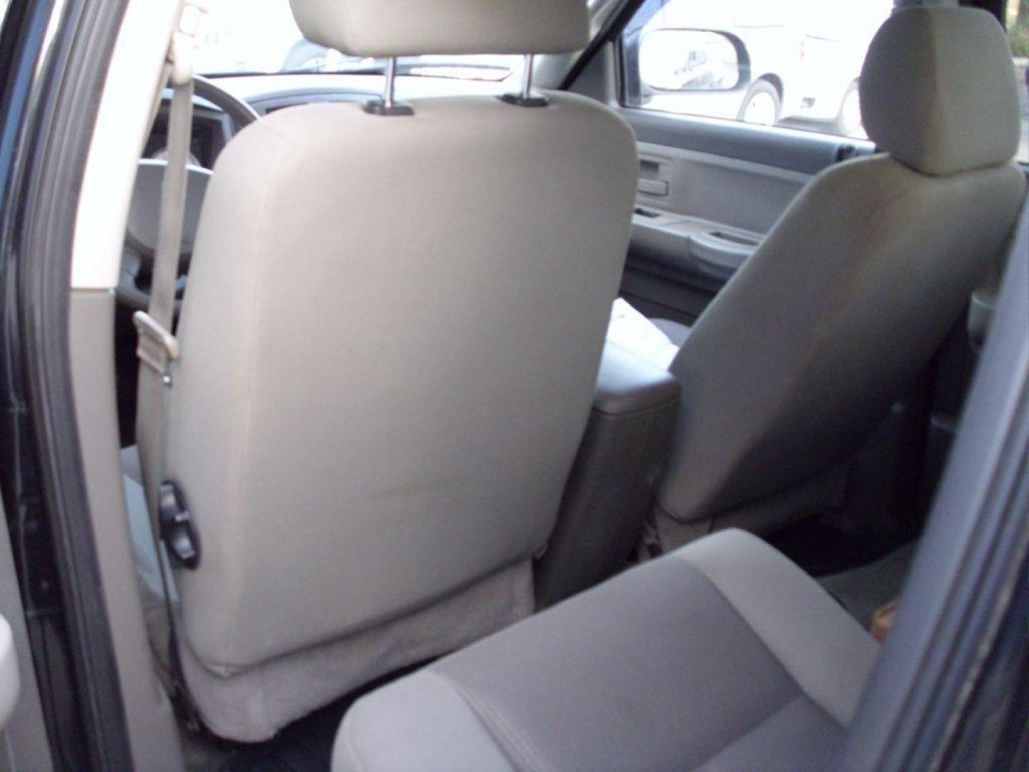 2006 BLACK DODGE DAKOTA QUAD SLT (1D7HW48N36S) with an 4.7L engine, Automatic transmission, located at 2215 Harry Wurzbach Rd , San Antonio, TX, 78209, (208) 269-7240, 29.491415, -98.432098 - GREAT TRUCK- 4X4 WITH AUTOMATIC TRANSMISSION; ABS Brakes; Alloy Wheels; Bed Liner; Cloth Seats; Cruise Control; Power Locks; CD; Passive sentry key; Available; Dual Front Air Bag; Active Belts; Tow Hitch; Crew Cab; Short Bed; All Wheel ABS; 1/2 Ton. ** WE DO NOT OFFER BUY HERE PAY HERE FINAN - Photo#12