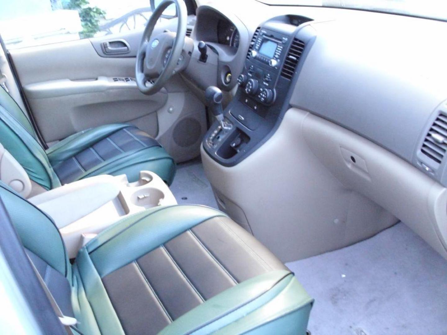 2012 TAN KIA SEDONA LX (KNDMG4C79C6) with an 3.5L engine, Automatic transmission, located at 2215 Harry Wurzbach Rd , San Antonio, TX, 78209, (208) 269-7240, 29.491415, -98.432098 - PERFECT VAN FOR ROADTRIPS- THIRD ROW SEAT! ABS Brakes; Air Conditioning; AM/FM Stereo; Automatic Transmission; Auxiliary Audio Input; Bluetooth Technology; CD Audio; Cloth Seats; Cruise Control; Fold-Away Third Row; Overhead Airbags; Parking Sensors; Power Locks; Power Mirrors; Power Windows; Quad S - Photo#8