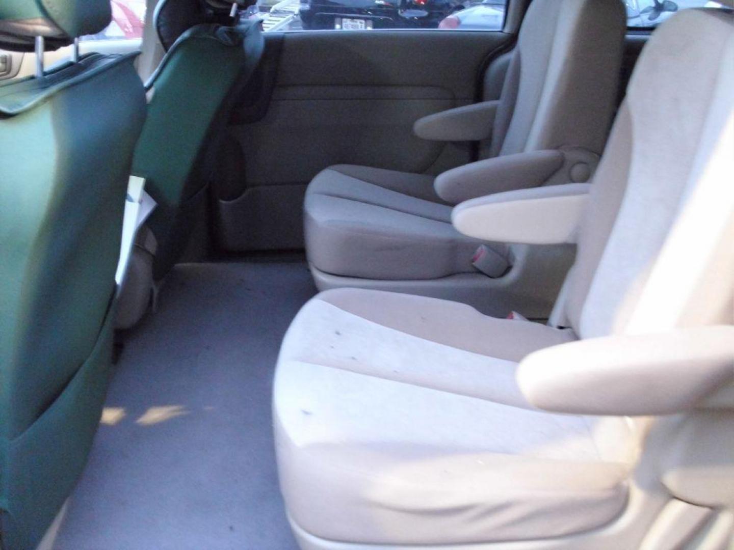 2012 TAN KIA SEDONA LX (KNDMG4C79C6) with an 3.5L engine, Automatic transmission, located at 2215 Harry Wurzbach Rd , San Antonio, TX, 78209, (208) 269-7240, 29.491415, -98.432098 - PERFECT VAN FOR ROADTRIPS- THIRD ROW SEAT! ABS Brakes; Air Conditioning; AM/FM Stereo; Automatic Transmission; Auxiliary Audio Input; Bluetooth Technology; CD Audio; Cloth Seats; Cruise Control; Fold-Away Third Row; Overhead Airbags; Parking Sensors; Power Locks; Power Mirrors; Power Windows; Quad S - Photo#13