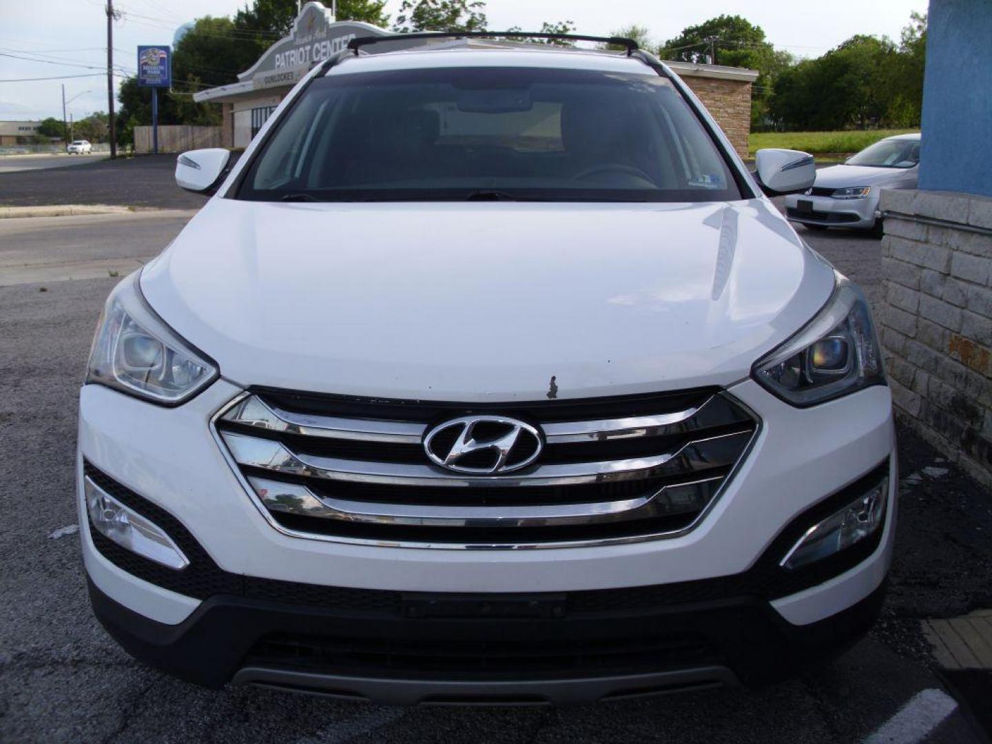 2014 WHITE HYUNDAI SANTA FE SPORT (5XYZUDLA7EG) with an 2.0L engine, Automatic transmission, located at 2215 Harry Wurzbach Rd , San Antonio, TX, 78209, (208) 269-7240, 29.491415, -98.432098 - 4 WHEEL DRIVE WITH ALLOY WHEELS! TURBO CHARGED ENGINE!! Blind Spot Monitor; Leather Seats; Bluetooth Technology; Front Seat Heaters; Full Roof Rack; Infinity Sound System; Navigation System; Rear Defroster; Rear Sunshade; Rear View Camera; Air Conditioning; Power Windows; Power Locks; Power Steering - Photo#3