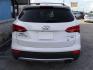 2014 WHITE HYUNDAI SANTA FE SPORT (5XYZUDLA7EG) with an 2.0L engine, Automatic transmission, located at 2215 Harry Wurzbach Rd , San Antonio, TX, 78209, (208) 269-7240, 29.491415, -98.432098 - 4 WHEEL DRIVE WITH ALLOY WHEELS! TURBO CHARGED ENGINE!! Blind Spot Monitor; Leather Seats; Bluetooth Technology; Front Seat Heaters; Full Roof Rack; Infinity Sound System; Navigation System; Rear Defroster; Rear Sunshade; Rear View Camera; Air Conditioning; Power Windows; Power Locks; Power Steering - Photo#5