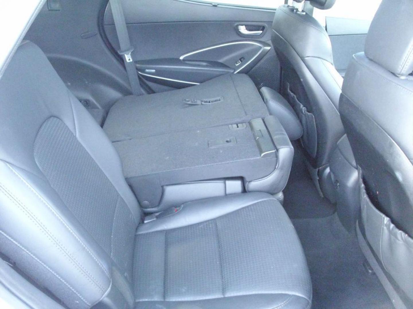 2014 WHITE HYUNDAI SANTA FE SPORT (5XYZUDLA7EG) with an 2.0L engine, Automatic transmission, located at 2215 Harry Wurzbach Rd , San Antonio, TX, 78209, (208) 269-7240, 29.491415, -98.432098 - 4 WHEEL DRIVE WITH ALLOY WHEELS! TURBO CHARGED ENGINE!! Blind Spot Monitor; Leather Seats; Bluetooth Technology; Front Seat Heaters; Full Roof Rack; Infinity Sound System; Navigation System; Rear Defroster; Rear Sunshade; Rear View Camera; Air Conditioning; Power Windows; Power Locks; Power Steering - Photo#11