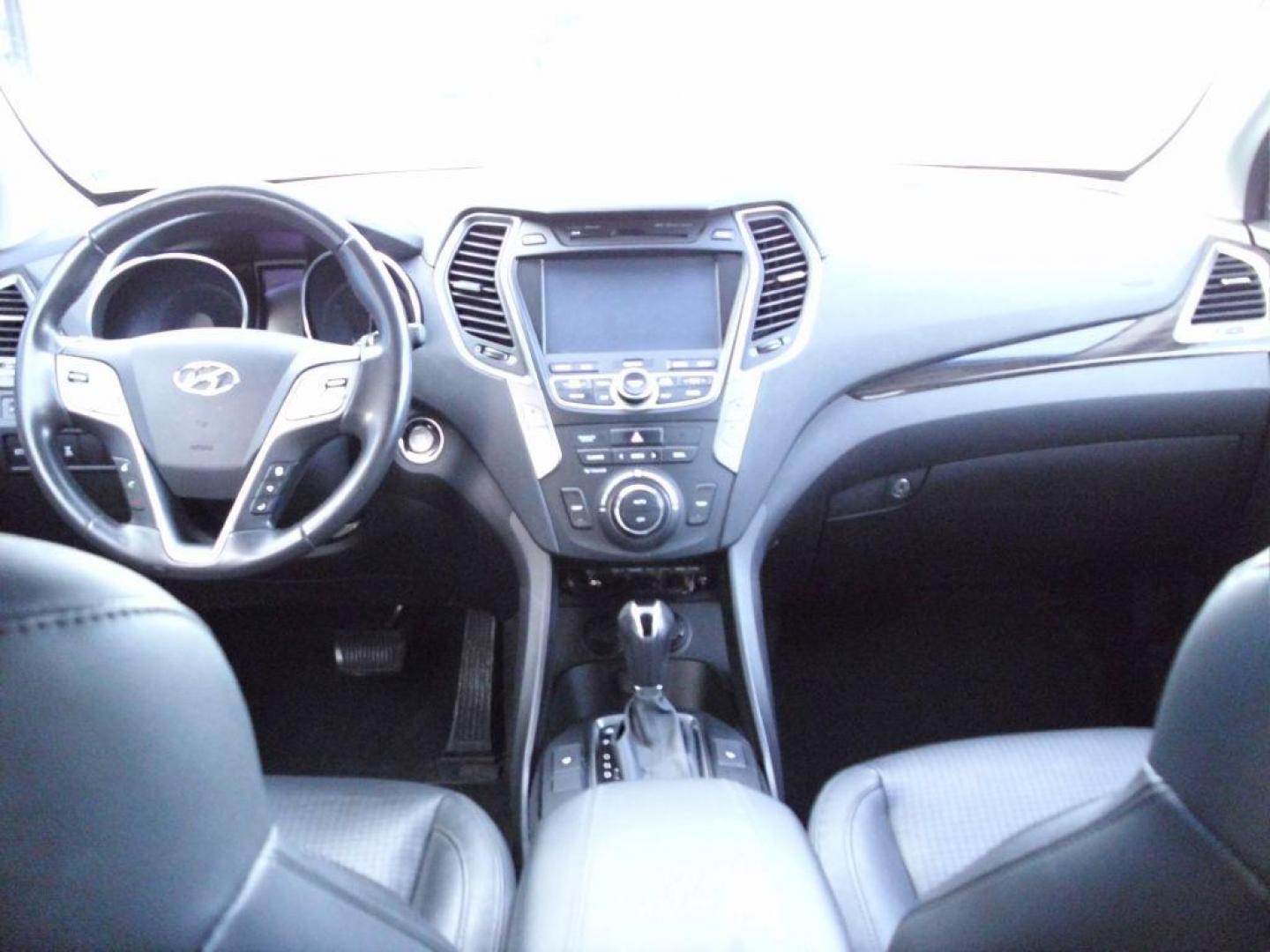 2014 WHITE HYUNDAI SANTA FE SPORT (5XYZUDLA7EG) with an 2.0L engine, Automatic transmission, located at 2215 Harry Wurzbach Rd , San Antonio, TX, 78209, (208) 269-7240, 29.491415, -98.432098 - 4 WHEEL DRIVE WITH ALLOY WHEELS! TURBO CHARGED ENGINE!! Blind Spot Monitor; Leather Seats; Bluetooth Technology; Front Seat Heaters; Full Roof Rack; Infinity Sound System; Navigation System; Rear Defroster; Rear Sunshade; Rear View Camera; Air Conditioning; Power Windows; Power Locks; Power Steering - Photo#15