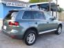2008 GREEN VOLKSWAGEN TOUAREG 2 VR6 FSI (WVGBE77L48D) with an 3.6L engine, Automatic transmission, located at 2215 Harry Wurzbach Rd , San Antonio, TX, 78209, (208) 269-7240, 29.491415, -98.432098 - ALL WHEEL DRIVE WITH ALLOY WHEELS!! Automatic Transmission; Parking Sensors; Leatherette Seats; Power Hatch/Deck Lid; Air Conditioning; Power Windows; Power Locks; Power Steering; Tilt Wheel; AM/FM CD; Satellite; Immobilizer; Keyless Entry; Alarm; Daytime Running Lights; Dual Air Bags Front Head and- Photo#2